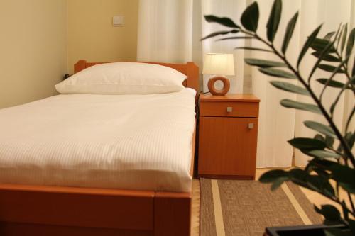 Postel nebo postele na pokoji v ubytování Rooms Villa Aria