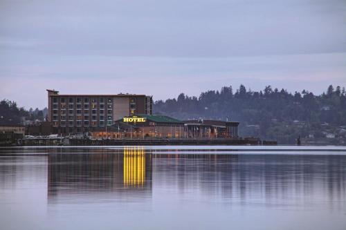 a hotel sitting next to a large body of water at The Mill Casino Hotel in North Bend