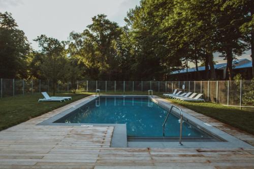 a swimming pool in a yard with a fence at Tourists in North Adams