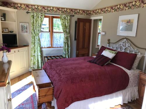 מיטה או מיטות בחדר ב-Baywick Inn Bed & Breakfast