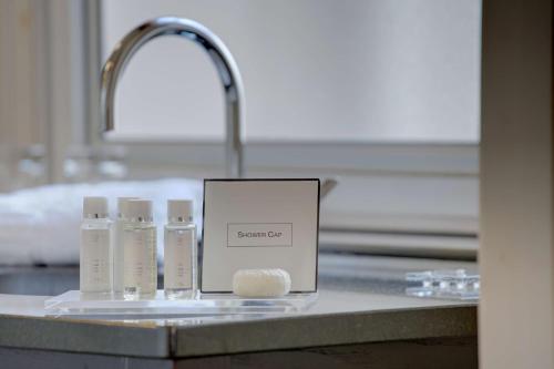 a box sitting on a counter next to a sink at Heywood House Hotel, BW Signature Collection in Liverpool