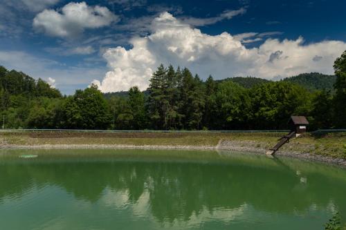 a large body of water with trees in the background at SALAMANDRA Hotel in Banská Štiavnica
