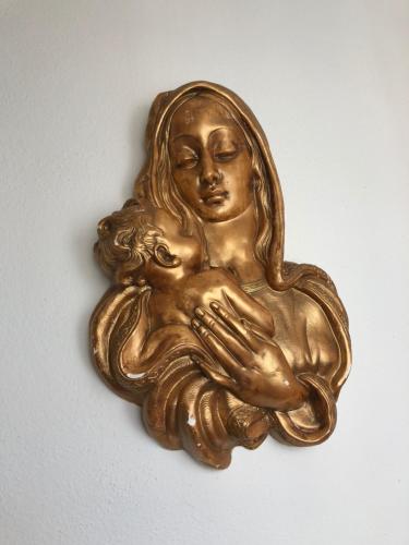 a gold statue of a woman holding a baby at Fatima Belavista & Pool in Fátima