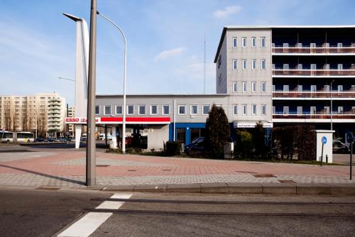 a building on a city street with a street light at Antwerp Harbour Hotel in Antwerp