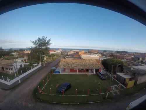 a view of a house with a yard at Center Hotel in Imbé