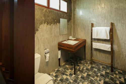a bathroom with a sink and a toilet at Chiang Dao Reset in Chiang Dao
