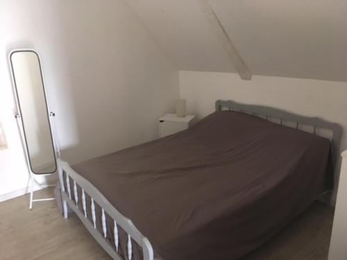 Ένα ή περισσότερα κρεβάτια σε δωμάτιο στο LE GRAND PARADIS