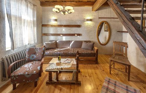 a living room with a couch and a table at Penzión Tokaj Ostrožovič in Veľká Tŕňa