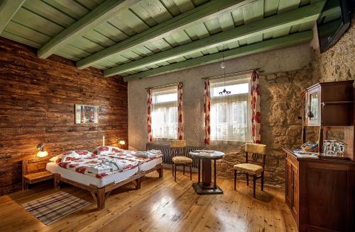 A bed or beds in a room at Penzión Tokaj Ostrožovič