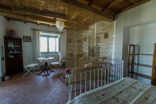 Ένα ή περισσότερα κρεβάτια σε δωμάτιο στο Agriturismo Specchio Del Lago