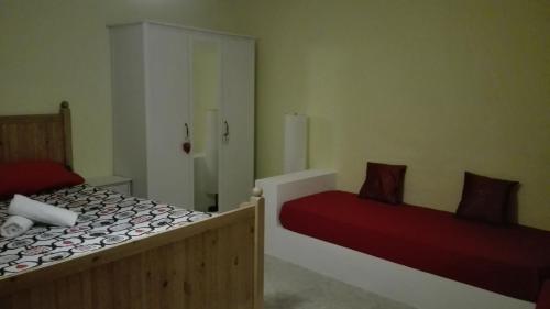 a bedroom with two beds and a shower in it at Sally's House in Venaria Reale