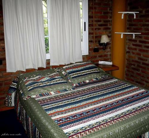Una cama o camas en una habitación de Complejo Nailut
