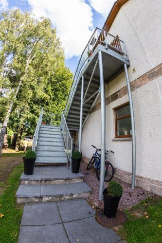 a stairway leading up to a building with a stair case at Mulberry in Nairn