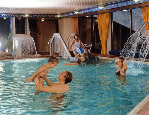 a group of children playing in a swimming pool at Finke in Travemünde