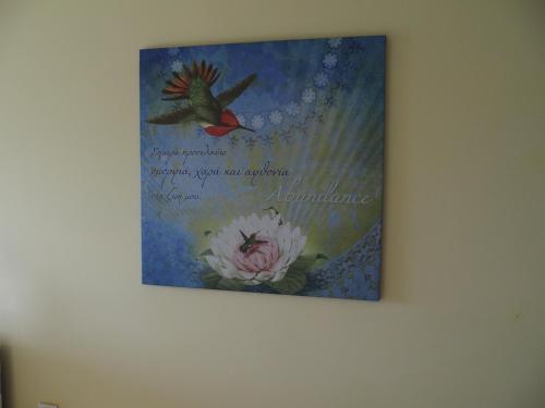 a picture of a bird and a flower on a wall at Ktima Noosfera Wellness & Retreat Center in Nees Vrisoules