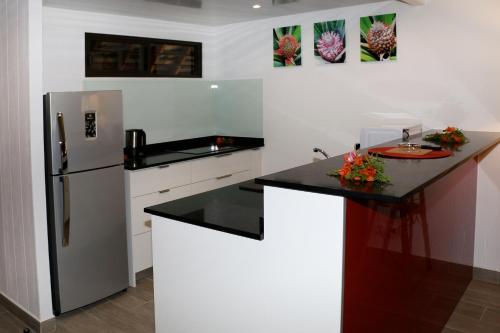Una cocina o zona de cocina en Hotel Hibiscus