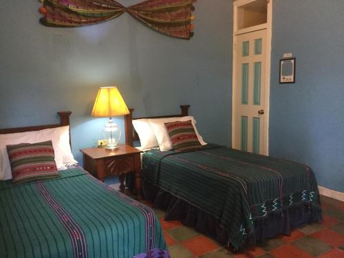 Uma cama ou camas num quarto em Hotel El Delfin