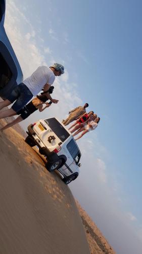 a man standing on top of a skateboard on a ramp at Legend Desert camp in Fulayj al Mashāʼikh