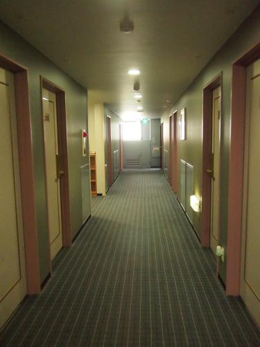 an empty hallway in an office building at GR Hotel Suidocho in Kumamoto