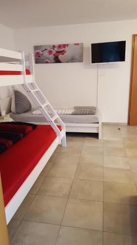 Cama o camas de una habitación en Ferienwohnung Am Eck