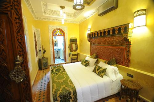 Voodi või voodid majutusasutuse Riad Mama H&K toas