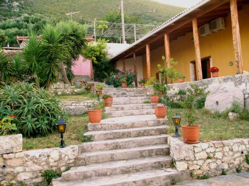 a set of stone stairs in front of a house at Archontiko Maisonettes in Alykes