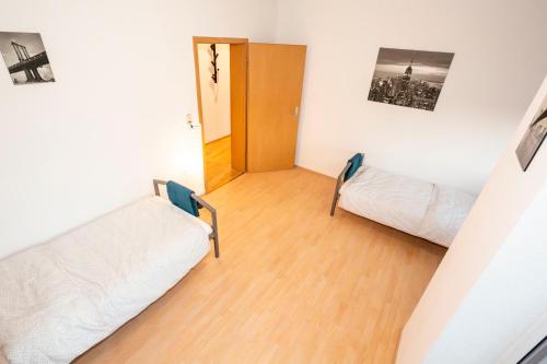 Postel nebo postele na pokoji v ubytování AVR Apartment HOF 11