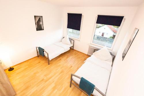 Postel nebo postele na pokoji v ubytování AVR Apartment HOF 11