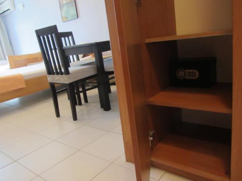 a dining room table and chairs in a room at Cernogoriya voyage in Rafailovici