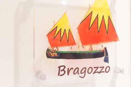 a sign for a refrigerator with a boat on it at porto canale b & b in Cesenatico