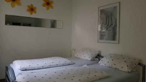 En eller flere senge i et værelse på Leipziger Zuhause