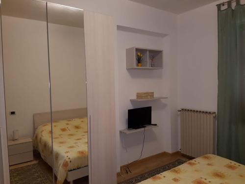 Postel nebo postele na pokoji v ubytování San Casciano
