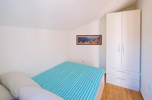 Ένα ή περισσότερα κρεβάτια σε δωμάτιο στο Apartment Kotor Bay