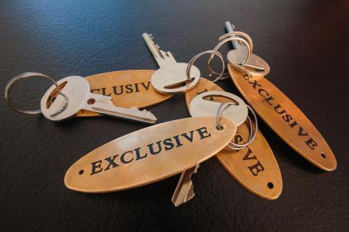 a group of keys on top of a table at Penzión Exclusive in Trenčín