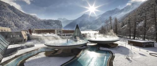 a resort with two water fountains in the snow at Ferienhaus Gerold Grießer in Umhausen