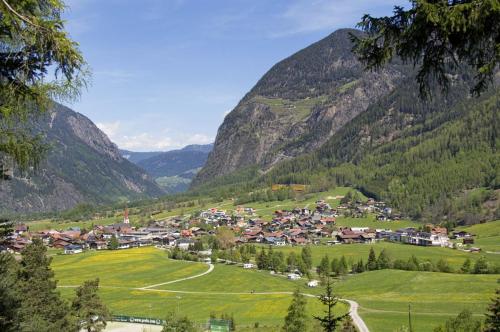 a small town in a valley in the mountains at Ferienhaus Gerold Grießer in Umhausen