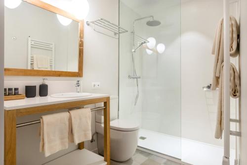 a bathroom with a shower and a toilet and a sink at Son Gris in Selva