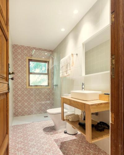 a bathroom with a sink and a toilet at Senda Caimari in Caimari