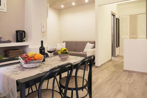 a kitchen and living room with a table and chairs at Pisetzky-Spadaro Apartments - Vegezio Roma in Rome