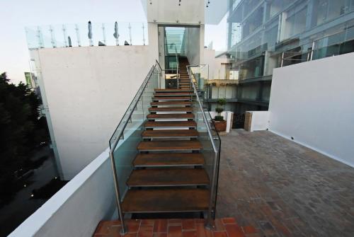 a stairway leading up to a building at Demetria Hotel in Guadalajara