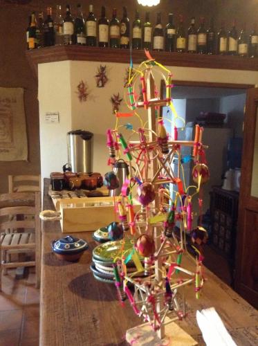 a colorful christmas tree on a table in a kitchen at Posada Yolihuani in Pátzcuaro