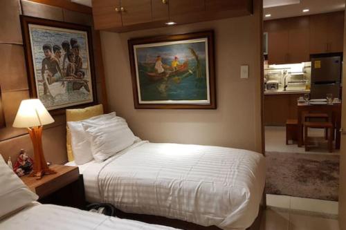 Tempat tidur dalam kamar di Stay Amare Residences Malate