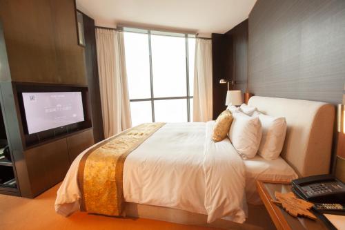 Säng eller sängar i ett rum på Hotel MoMc