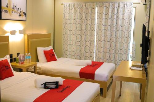Postel nebo postele na pokoji v ubytování RedDoorz Plus @ AS Fortuna Cebu