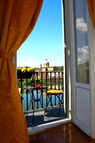 a view from a window of a balcony with a table at Residenza Vespucci in Florence