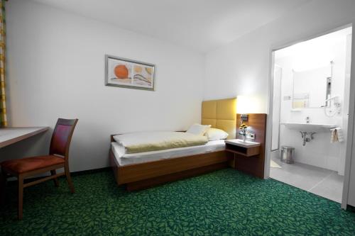 Krevet ili kreveti u jedinici u objektu Hotel Sonnenhof