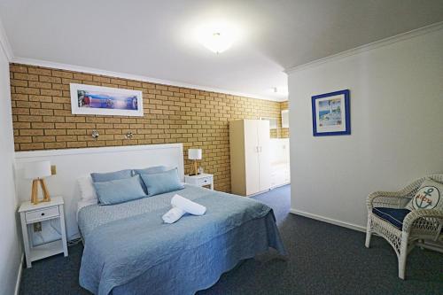 Una cama o camas en una habitación de Aquarius Merimbula