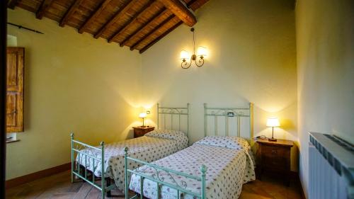 Ein Bett oder Betten in einem Zimmer der Unterkunft La Casa Del Fattore