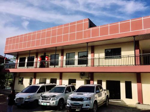 two cars parked on a balcony of a building at Sunrise Garden Lake Resort in Lahit