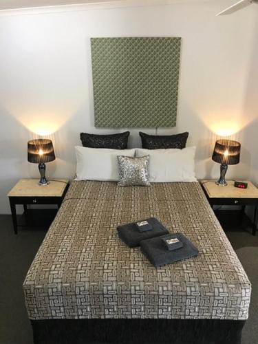 Postel nebo postele na pokoji v ubytování Central Motel Gin Gin